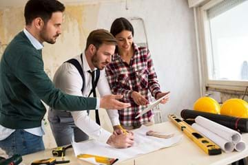 Architect working with couple on renovation